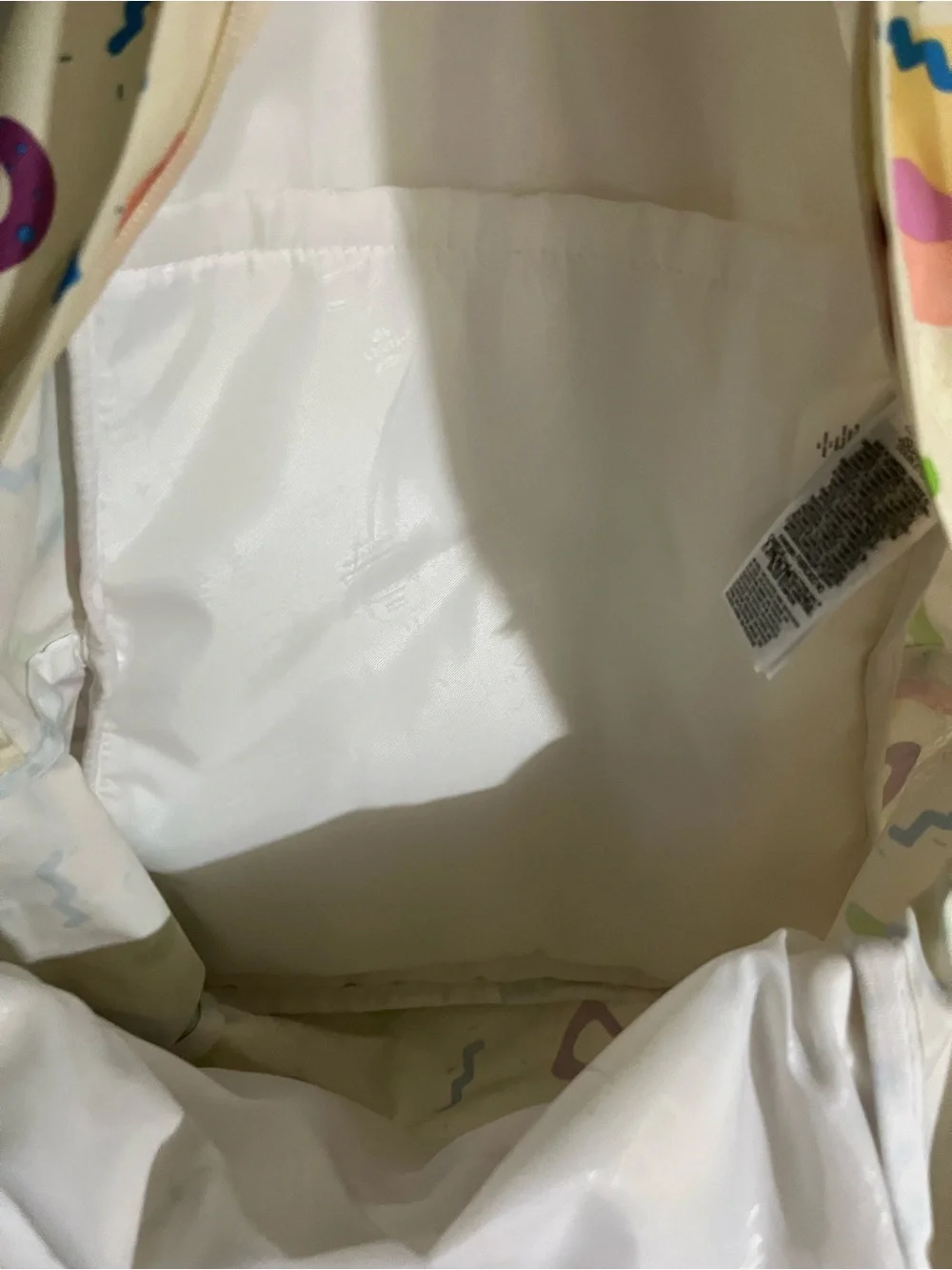 Jansport Cream Backpack with Multicolor Geometric Print
